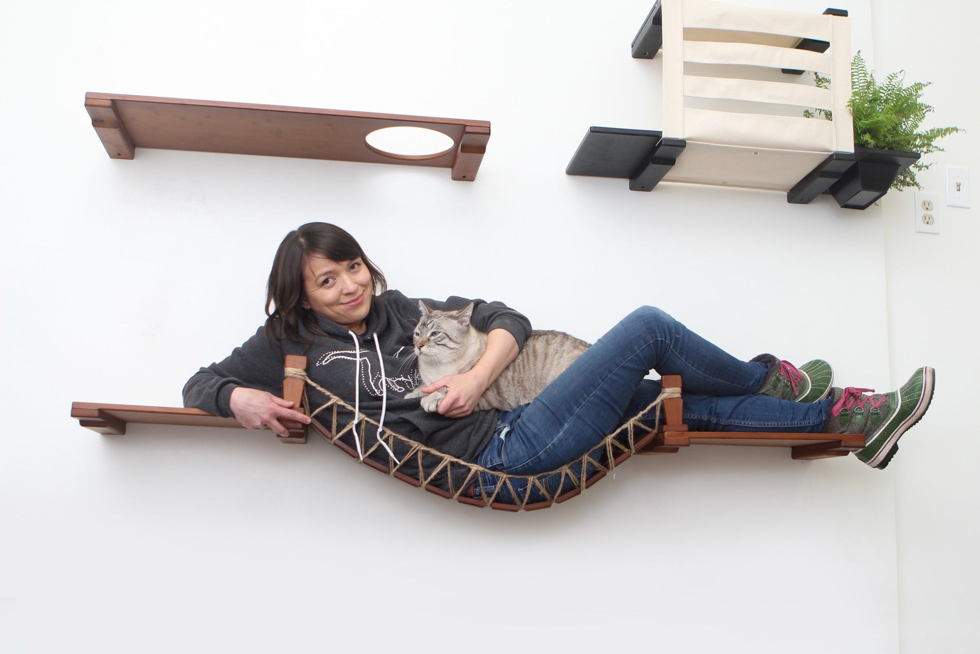 Photo of Cata associate demonstrating weight test. Do not try this at home, we're professionals.