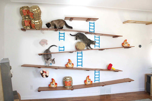 cats playing on donky kong themed wall furniture