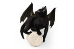 Black cat with bat wings on a white background