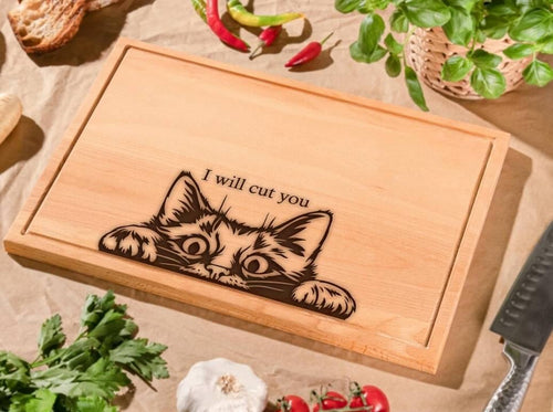 Cutting board with a cat decal on it