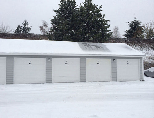 garage in the snow that functioned as an old workshop