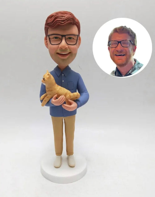 Bobble head hugging a cat 