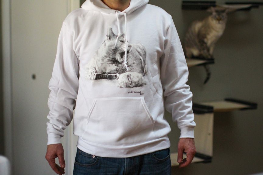 White hoodie with cat drawing