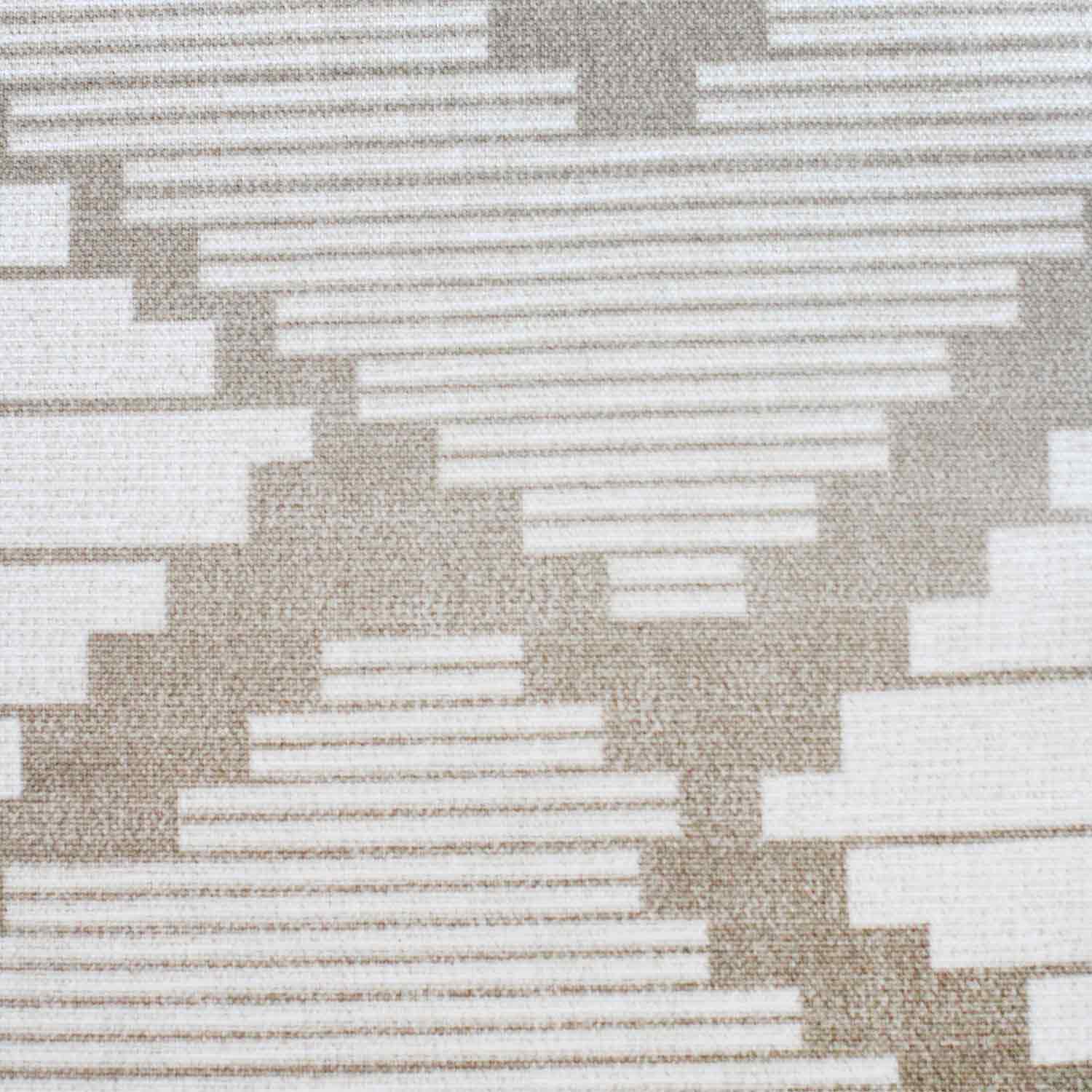 Textured fabric with a geometric pattern in neutral tones.