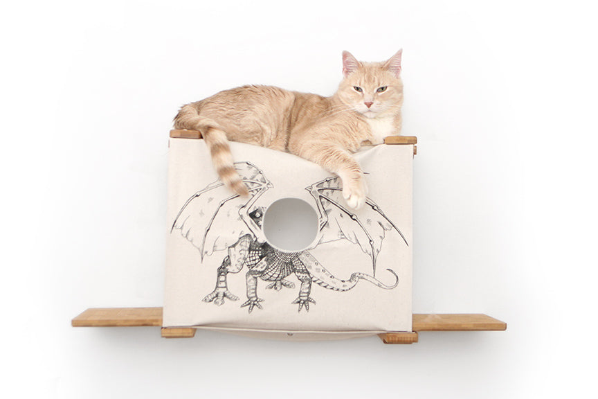 Large creamsicle cat holding court on top of a Cubby with Ledges. Pictured in Natural with Baby Dragon canvas.
