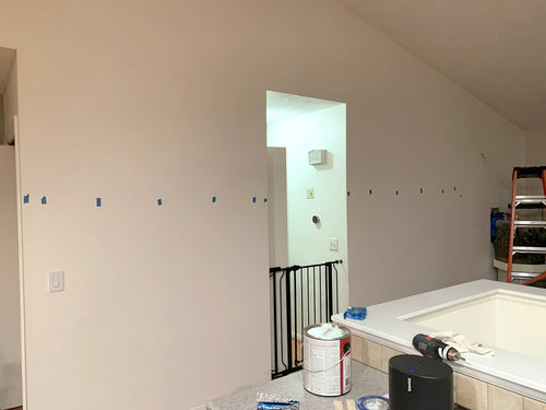 wall with stud locations marked off with painters tape