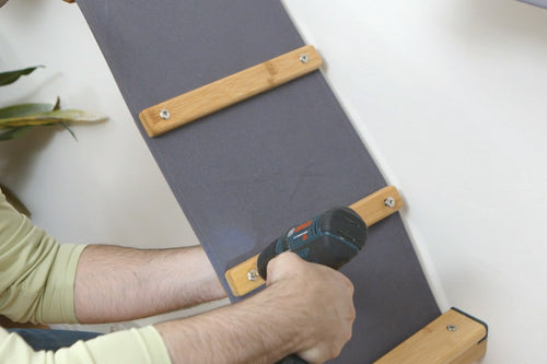 Demonstration of how to install ladder planks onto the angled cat ramp.