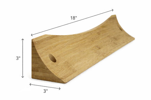 Wooden wedge-shaped block with dimensions labeled on a white background