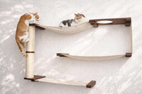 Cat tree with shelves and a scratching post on a white background