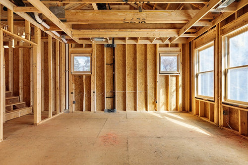 house interior with no drywall and has exposed floor and studs